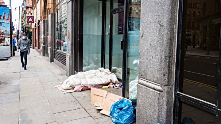 Homeless person's bedding in shop window