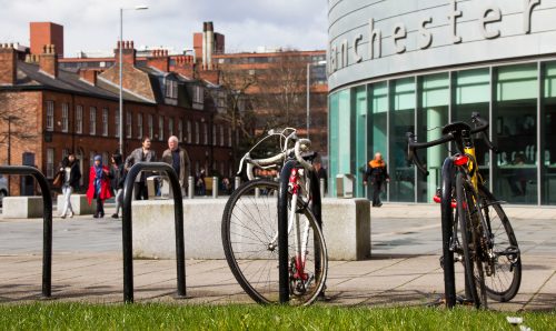 Parked bicycles outside University Place. 