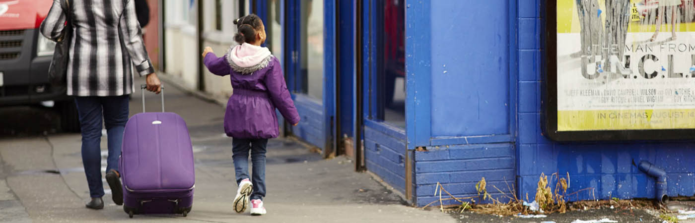 Child and adult on a Manchester street