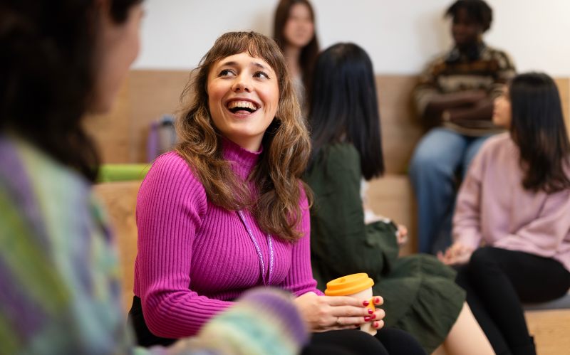 Smiling student in a lecture theatre 