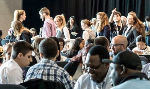 People sat at a conference