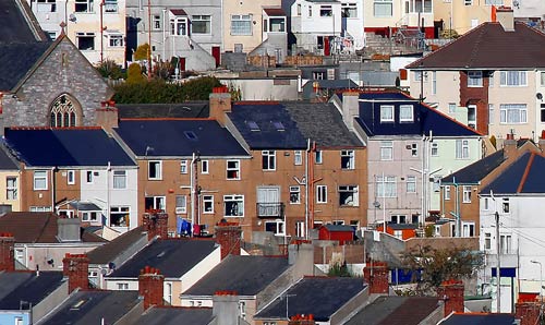 Rooftops of red-brick terraced houses
