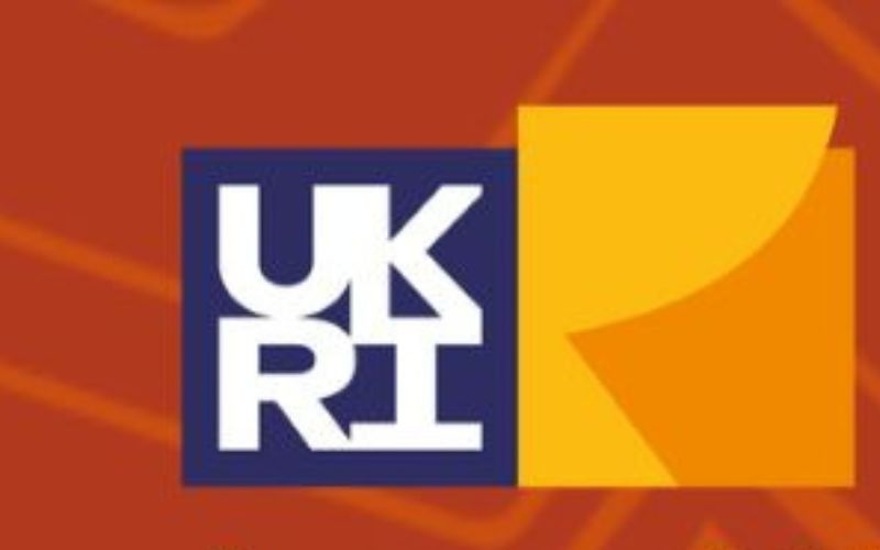 UKRI logo on a red background.