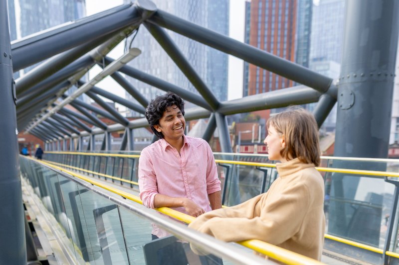 Students on a Manchester bridge.
