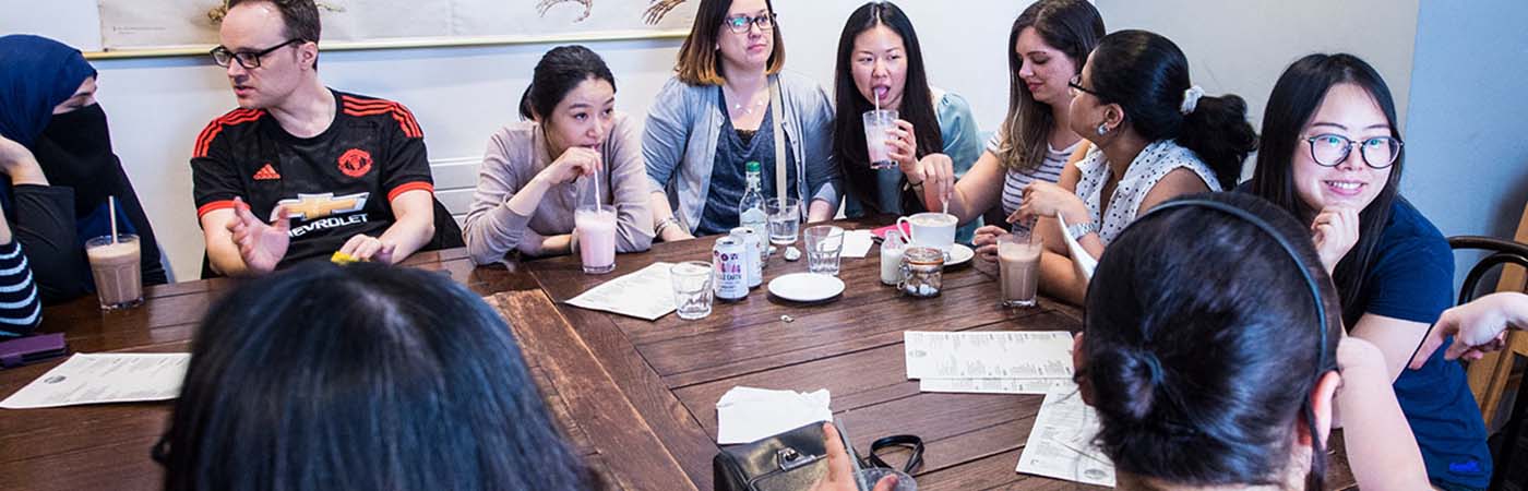 Group of people sat around a table