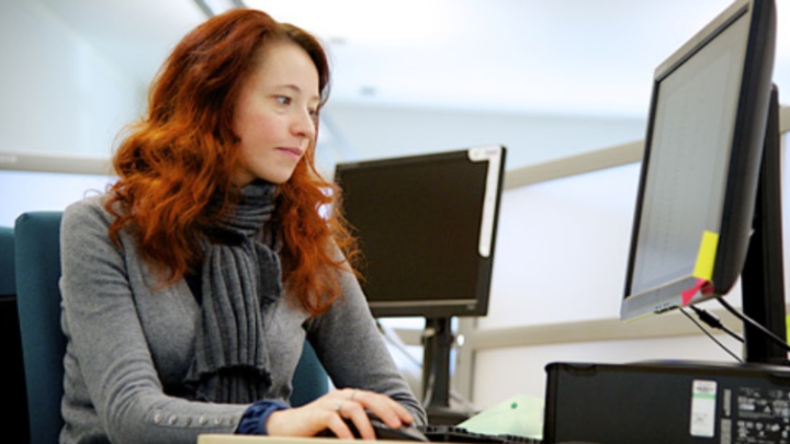 pgr student on a computer.