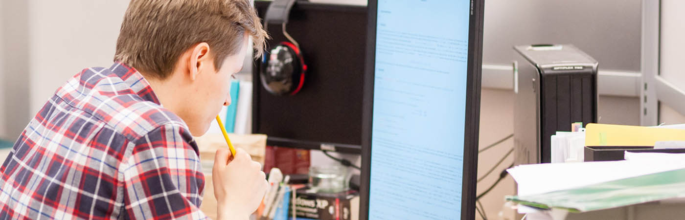 Male sat at desk doing work