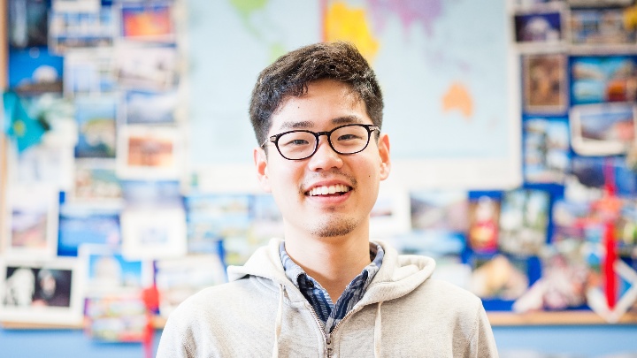 A student smiling to the camera